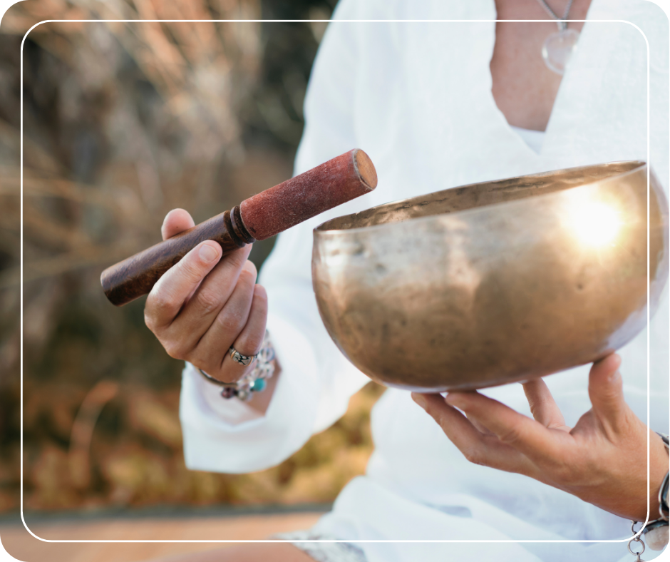 Person holding a sound bowl.