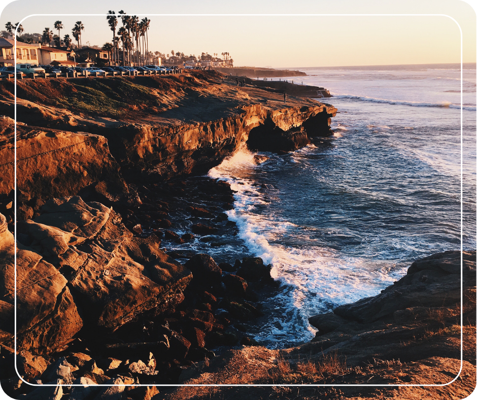 Cliffs and waves at dusk.