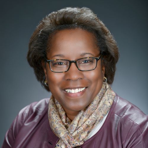 Headshot of Kim Hughes.