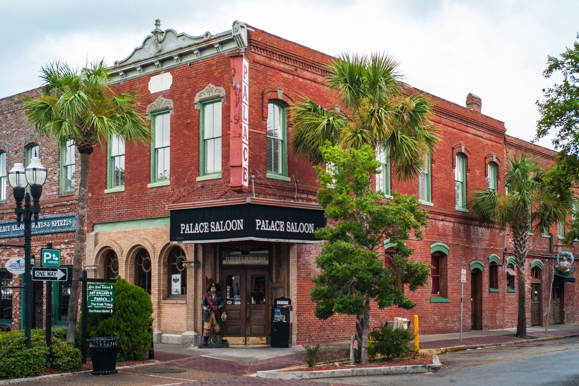 a large brick building with a black awning on the front of it .