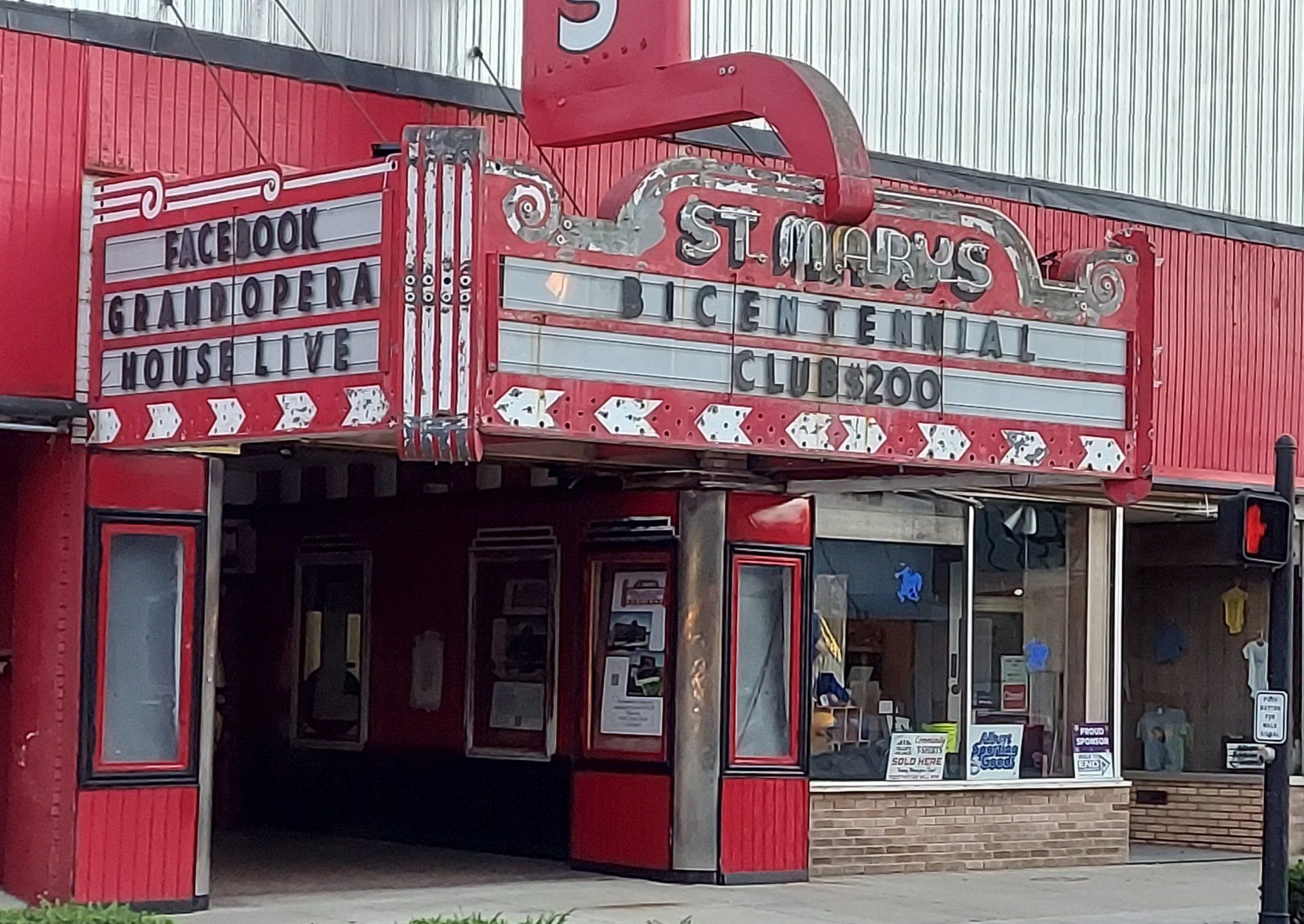 A red building with a sign that says ' stark 's ' on it