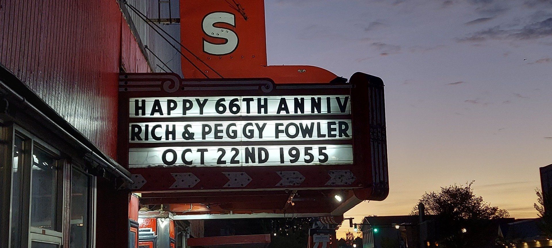 A sign that says happy 66th anniversary rich & peggy fowler oct 22nd 1955