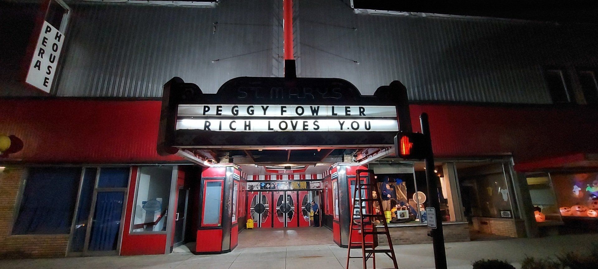 A movie theater with a sign that says piggy porter loves you
