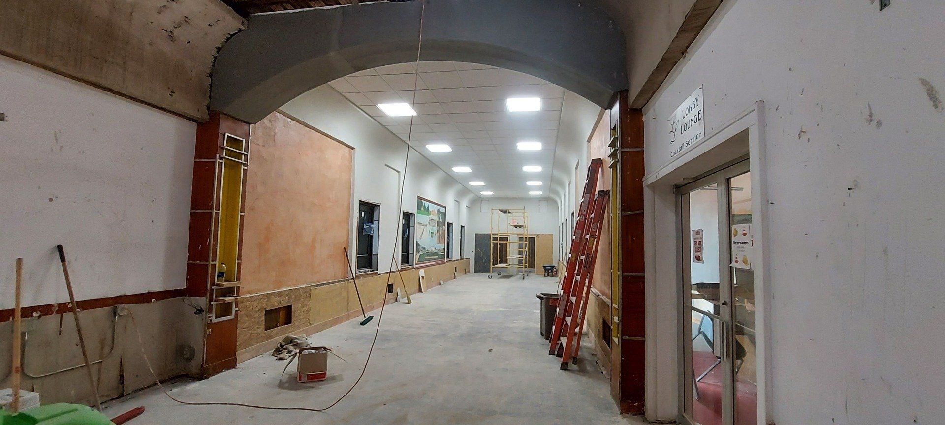 A long hallway in a building under construction.