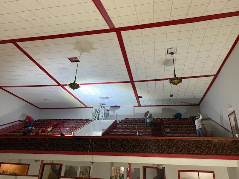 A large room with a red and white ceiling