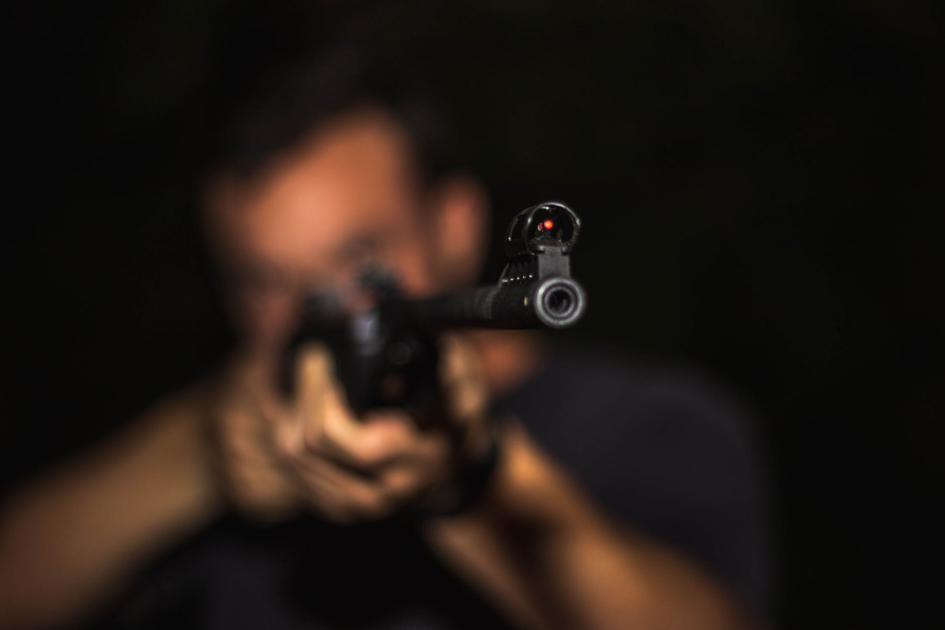 photo-of-man-holding-rifle