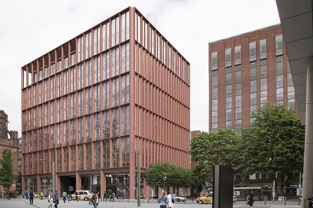 Modern brick building with a grid-like facade; people and trees in foreground.