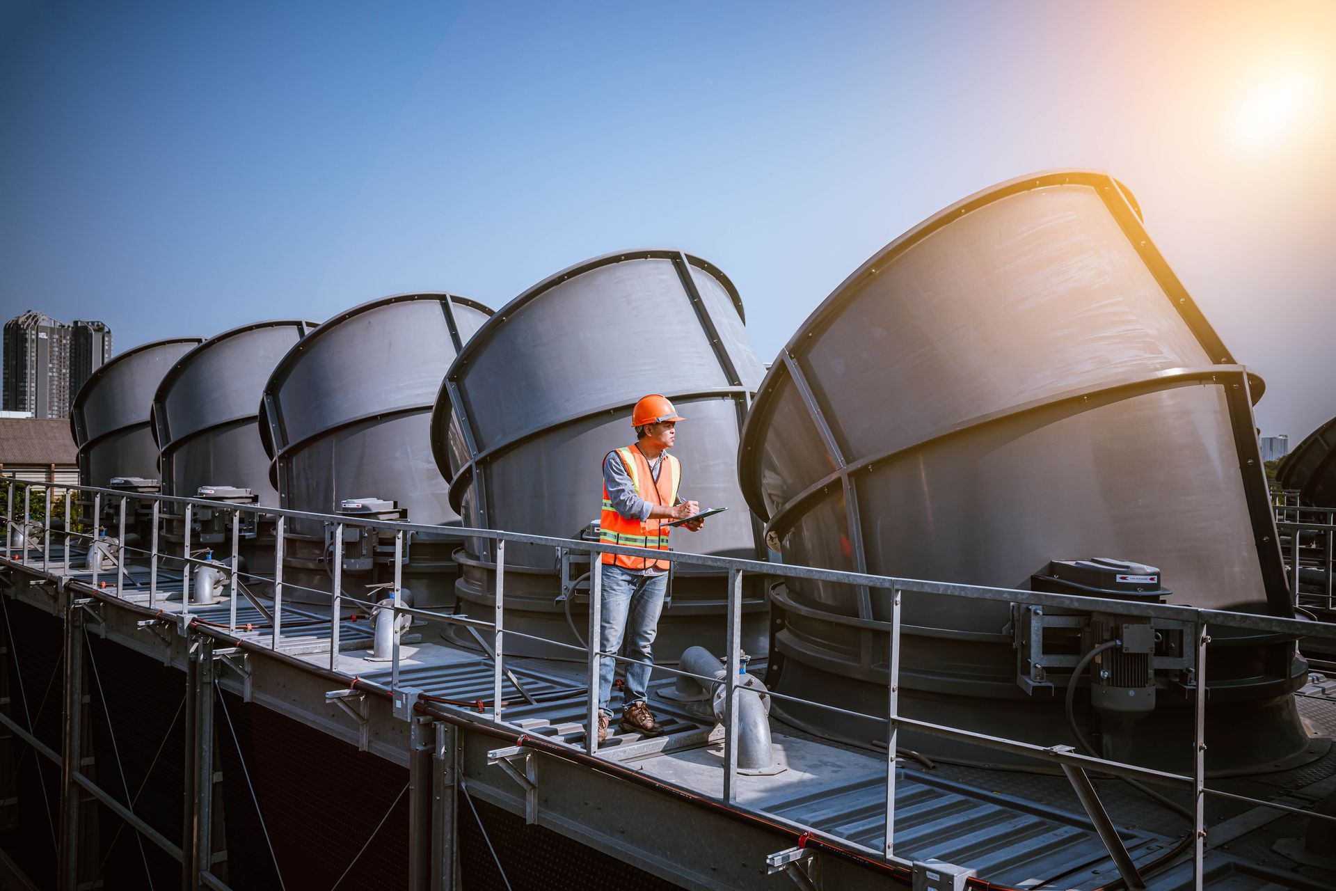 A man inspecting the roof of a commercial building