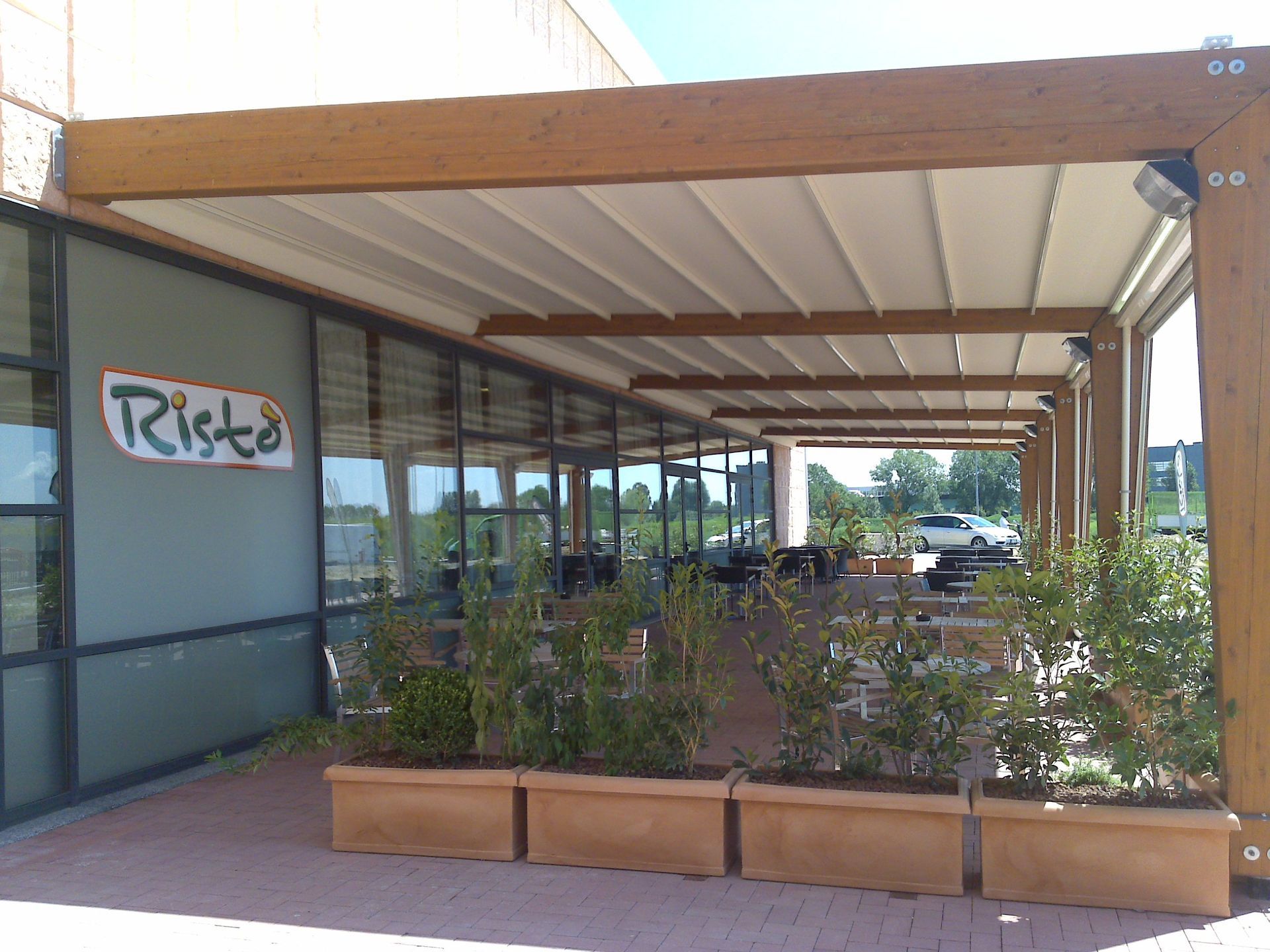 A restaurant with a pergola and a sign - Freehold, NJ - Awning Design Inc
