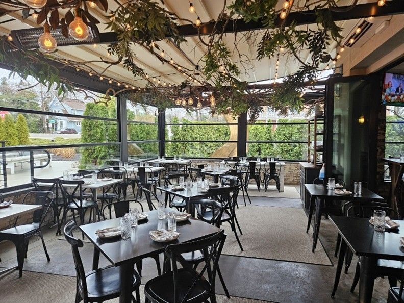 A restaurant with tables and chairs
