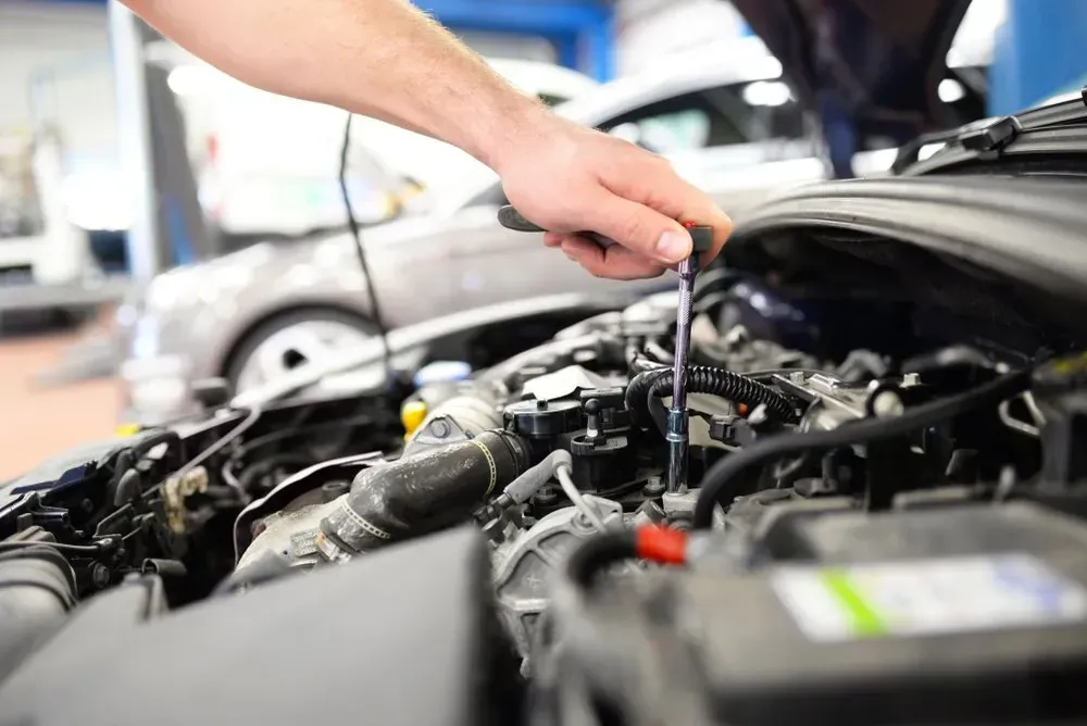 Mechanic Using a Wrench to Work on a Car Engine in a Repair Shop — B Wild Auto Repairs In North Gosford, NSW