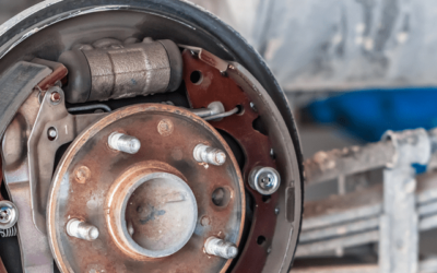 A close up of a brake caliper on a car.