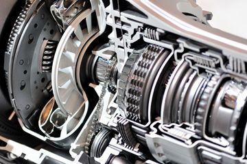A close up of the inside of a car engine.