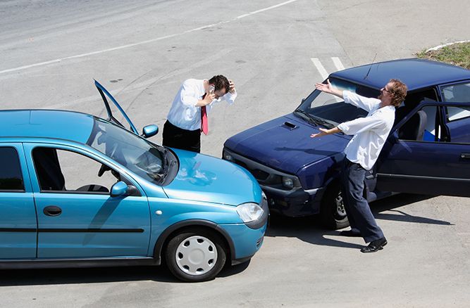 Two men are standing next to each other after a car accident
