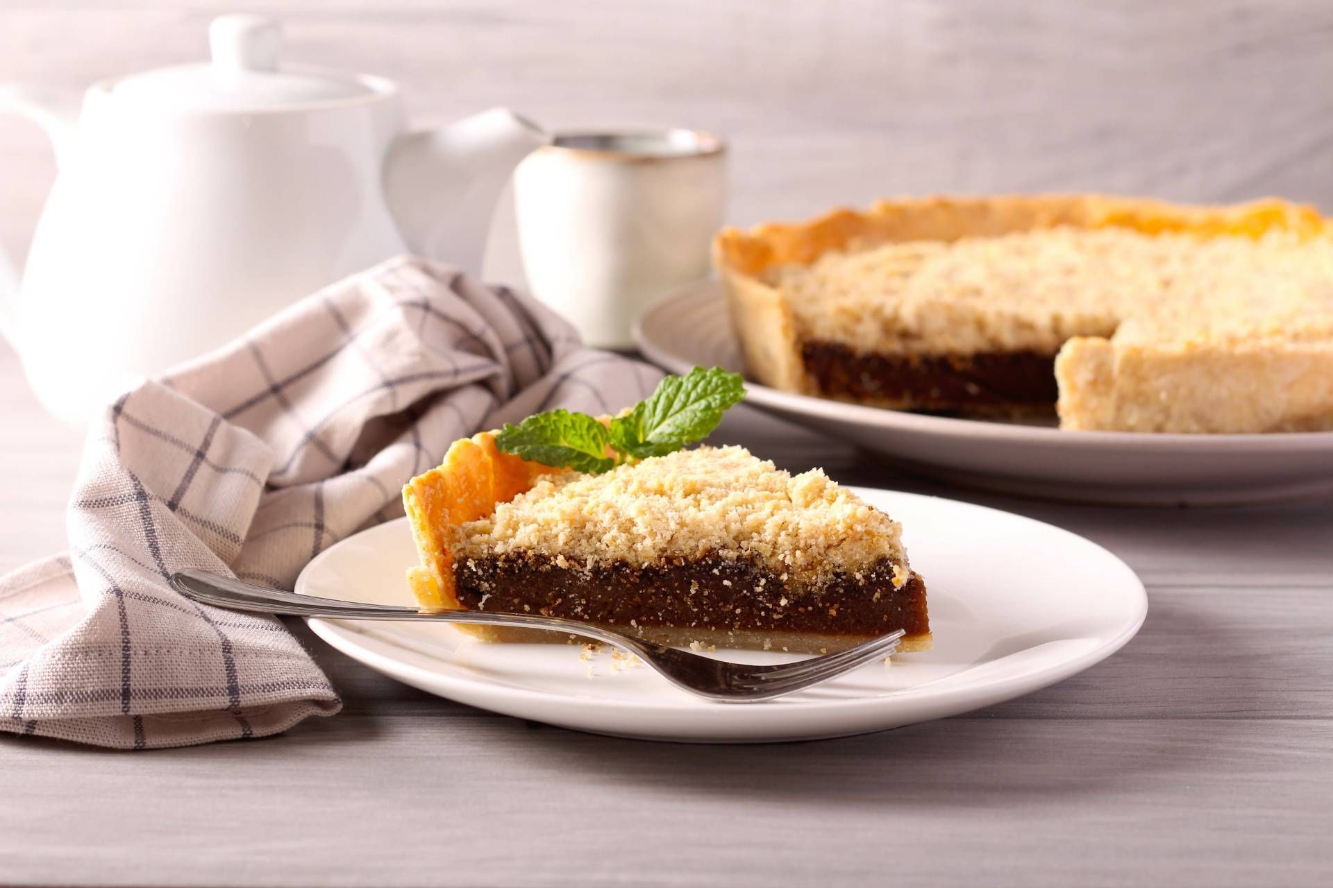 There is a slice of pie on a plate with a fork.