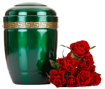 Green funeral urn with gold band beside a bouquet of red roses
