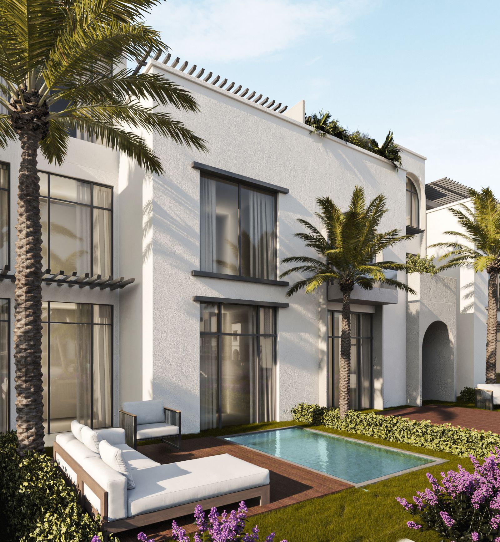 Modern white villa with palm trees, patio seating, and a small turquoise pool in a landscaped courtyard
