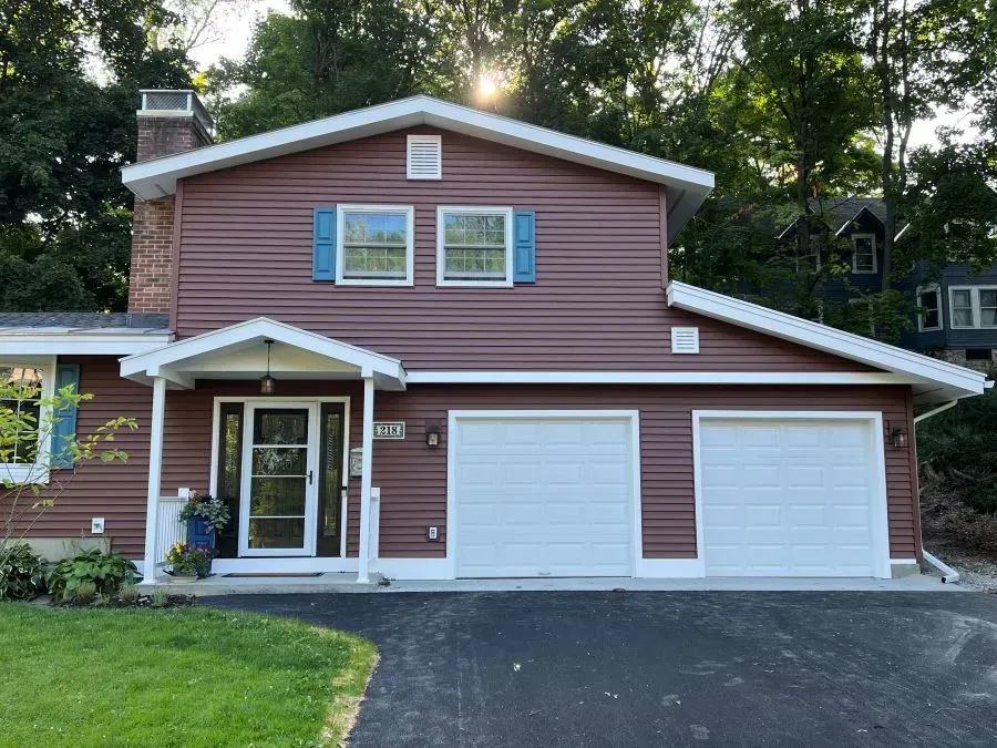 New vinyl siding and replacement of garage bay