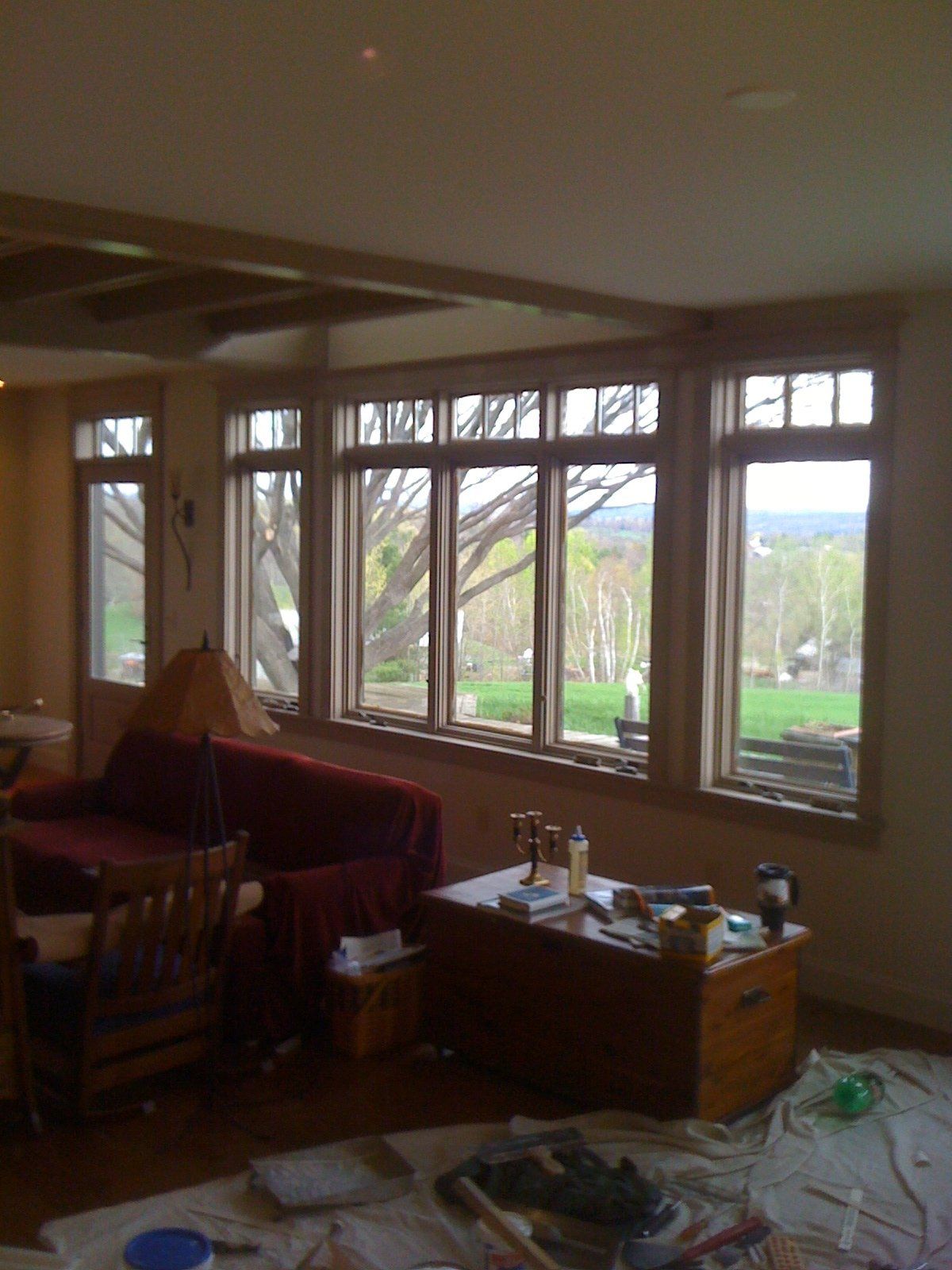 A living room with lots of windows and a couch
