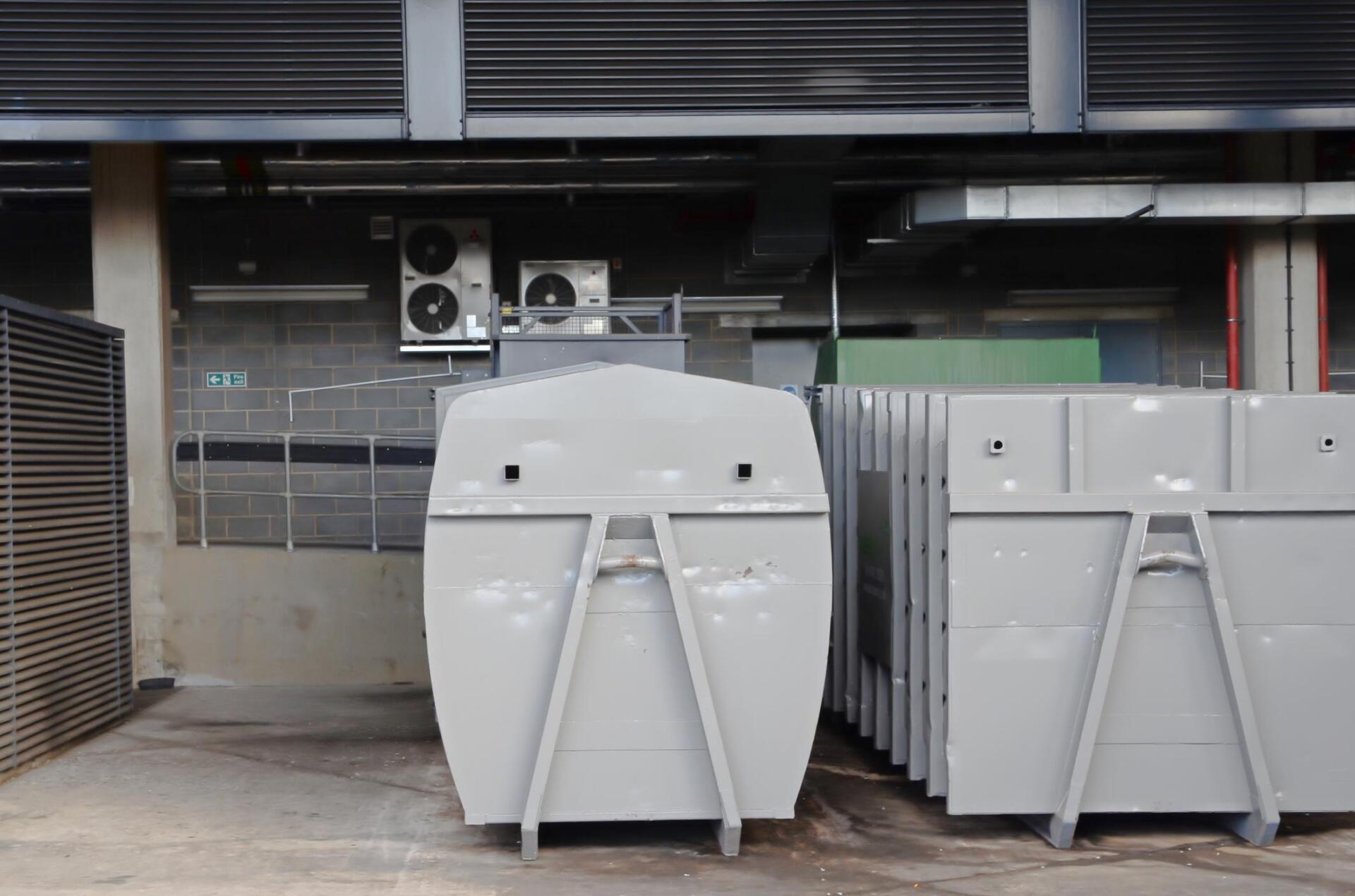garbage dumpster outside the building