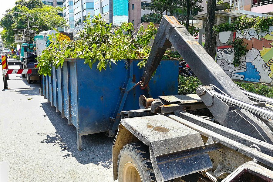 trailer truck carrying garbage dumpster