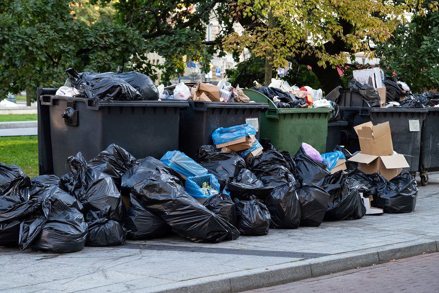 many garbages near the road