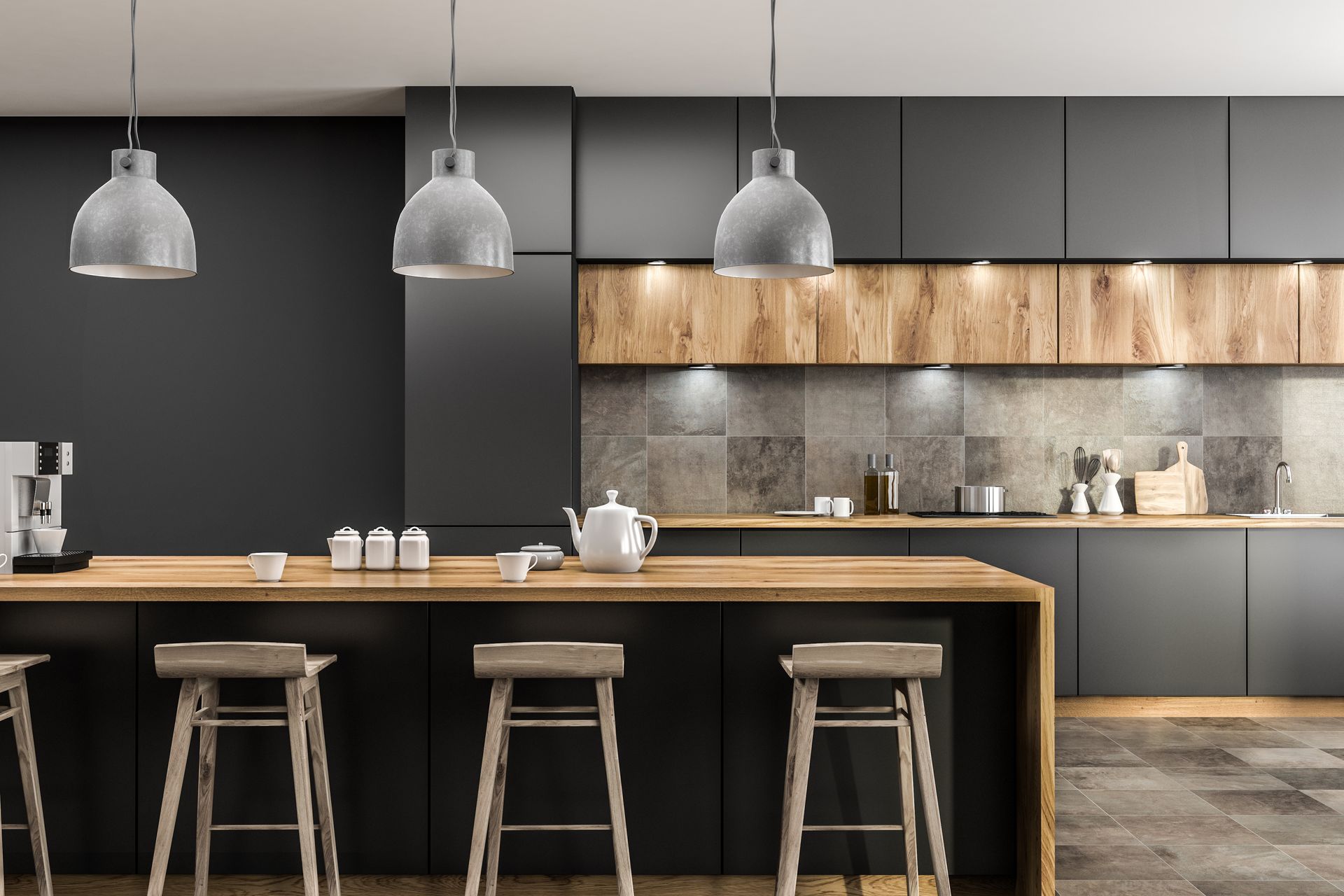 Une cuisine moderne avec un îlot central en bois, des tabourets de bar, des armoires gris foncé et un éclairage chaleureux sous les armoires.