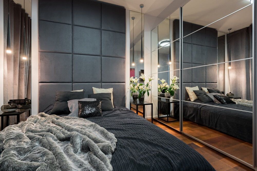 A Bedroom with A Bed, Mirrors and A Large Wardrobe — Colour Splash in Hunter Valley, NSW