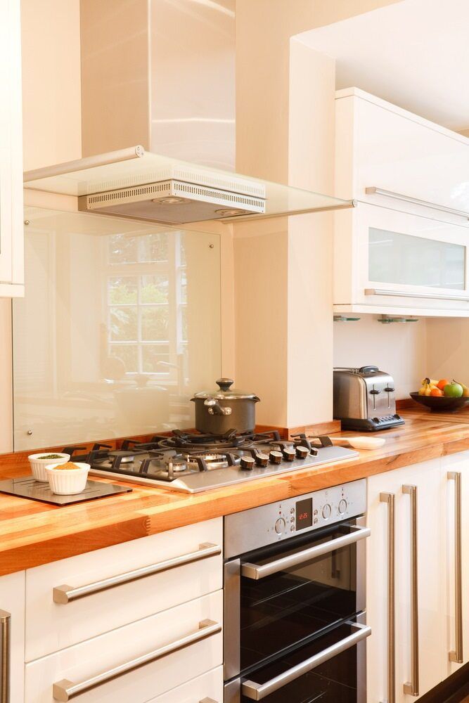 A Kitchen with A Stove Top Oven and A Toaster Oven — Colour Splash in Cessnock, NSW