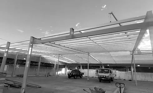 Building Under Construction with A Truck Parked Underneath It — Custom Steel Fab in Garbutt, QLD