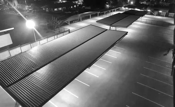 A Black and White Photo of A Parking Lot at Night — Custom Steel Fab in Garbutt, QLD