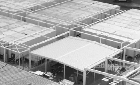 A Black and White Photo of A Building Under Construction — Custom Steel Fab in Garbutt, QLD