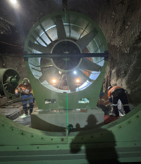 Workers Inside a Large Green Industrial Turbine, Inspecting Its Interior With Bright Lights — Custom Steel Fab in Bohle, QLD