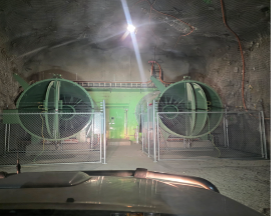 Nighttime View of Two Large Green Industrial Fans Behind a Gate, Seen From Inside a Car — Custom Steel Fab in Bohle, QLD