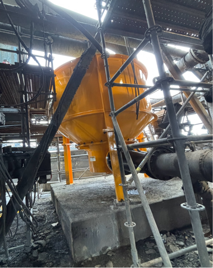 Orange Industrial Tank and Metal Pipes Inside a Factory Scaffolding Area — Custom Steel Fab in Bohle, QLD