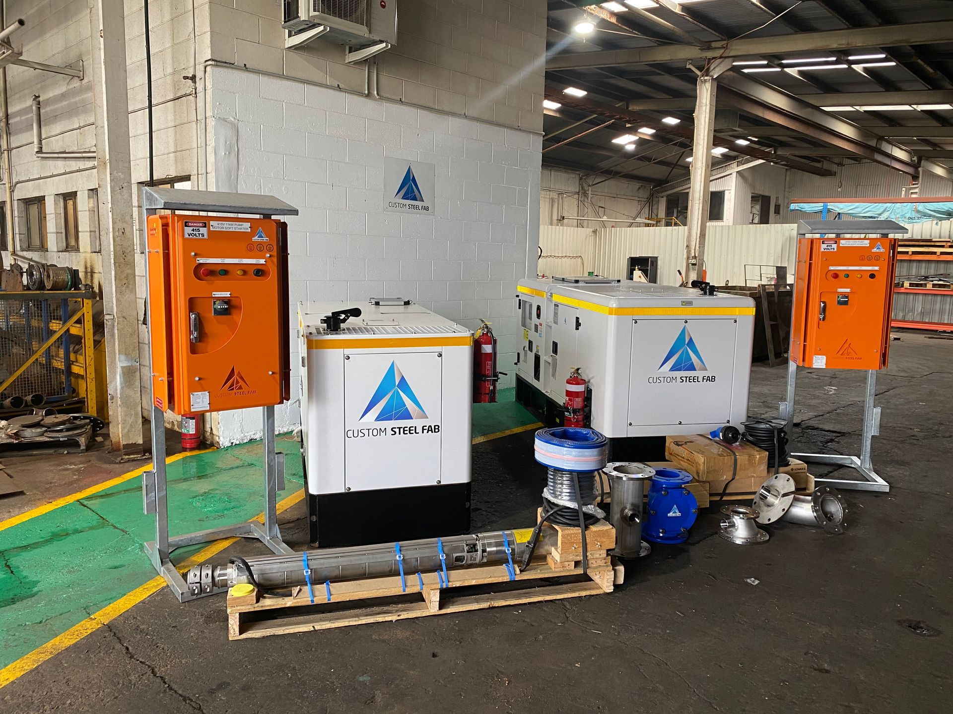 Industrial Equipment With Orange and White Control Boxes — Custom Steel Fab in Bohle, QLD
