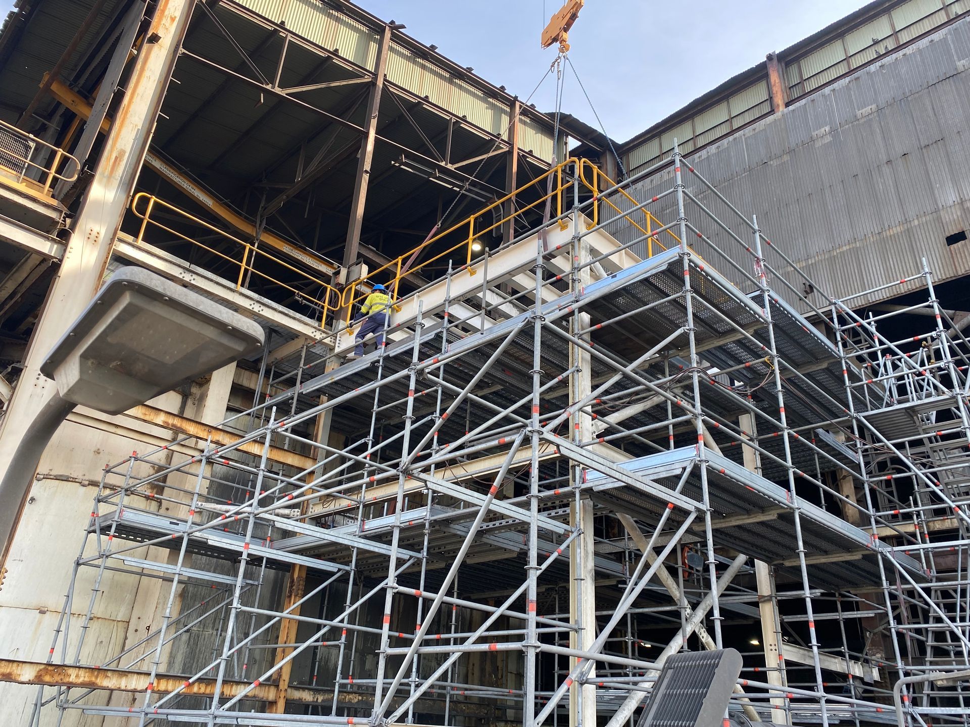 Scaffolding Supporting a Partially Built Concrete Structure at a Construction Site — Custom Steel Fab in Bohle, QLD