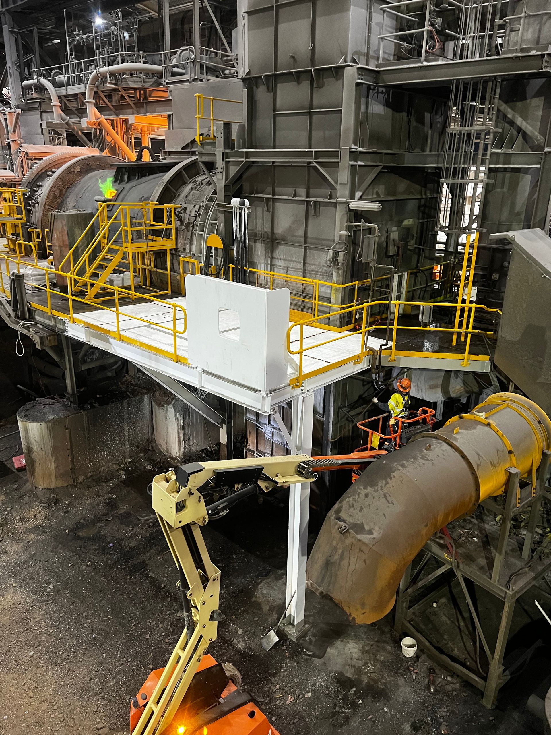 Industrial Machinery With Workers on a Yellow-railed Platform — Custom Steel Fab in Bohle, QLD