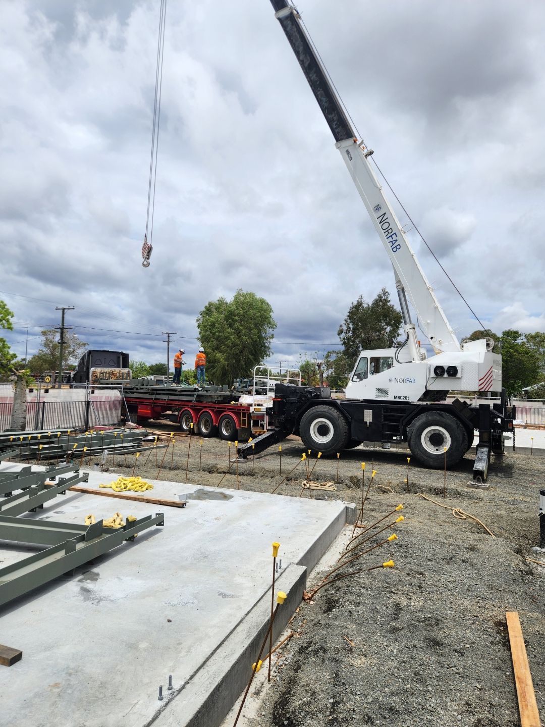 A Large Crane Is Sitting On Top Of A Construction Site — Custom Steel Fab in Garbutt, QLD
