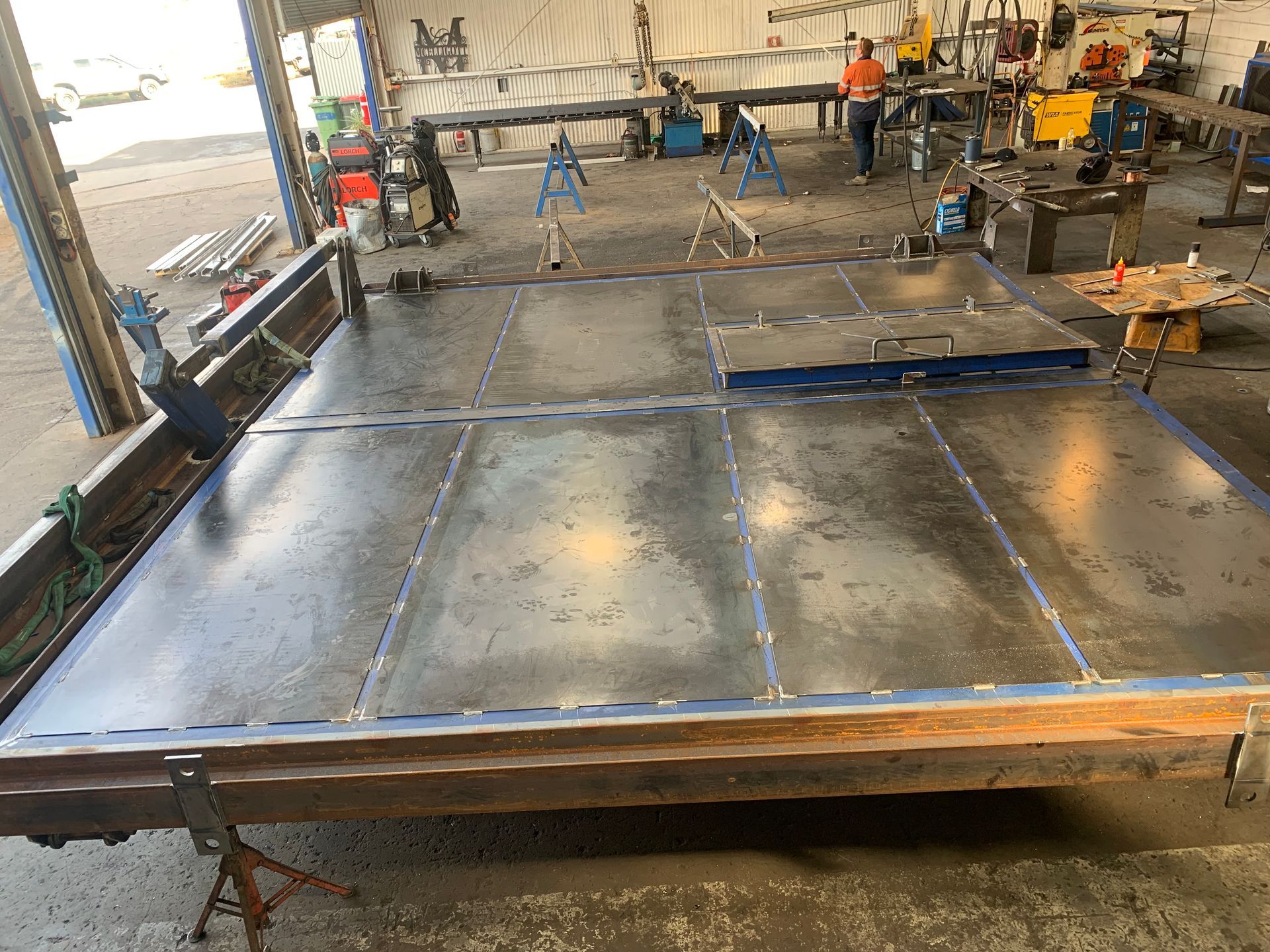 A Large Piece Of Metal Is Sitting In A Workshop — Custom Steel Fab in Garbutt, QLD