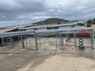 Industrial Rooftop Under Construction With Steel Framing, Concrete Deck — Custom Steel Fab in Bohle, QLD