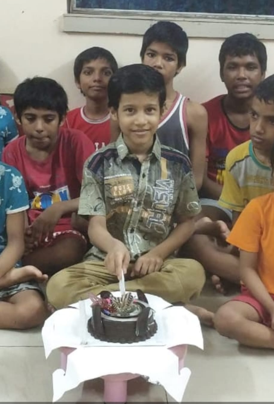 B celebrating his 8th birthday now reunited with his family