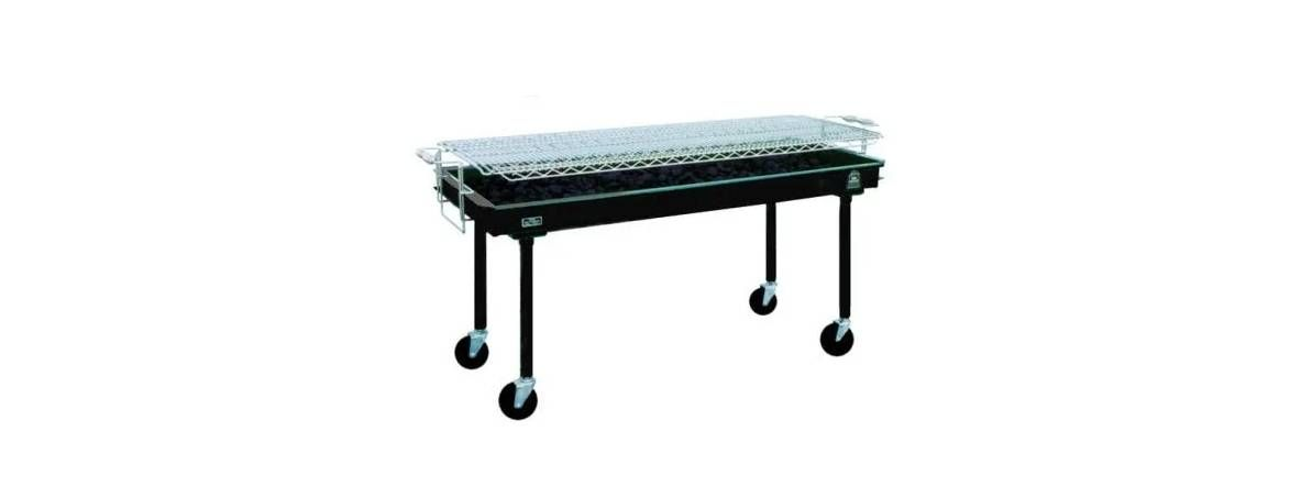 A long, black charcoal barbecue grill with a stainless steel grate on four legs with wheels, isolated on a white background.