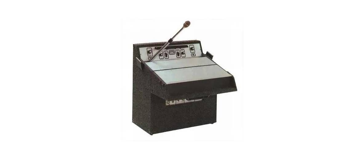 A rectangular, silver-colored metal baking sheet with a perforated surface for even heat distribution.