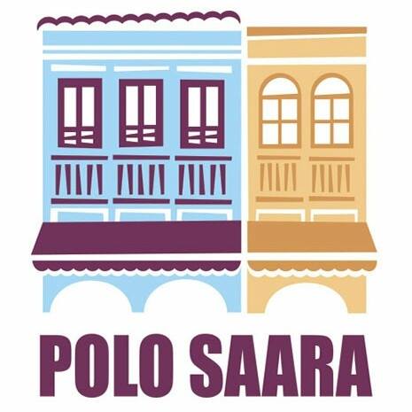 Dois prédios coloridos com janelas em arco e a inscrição
