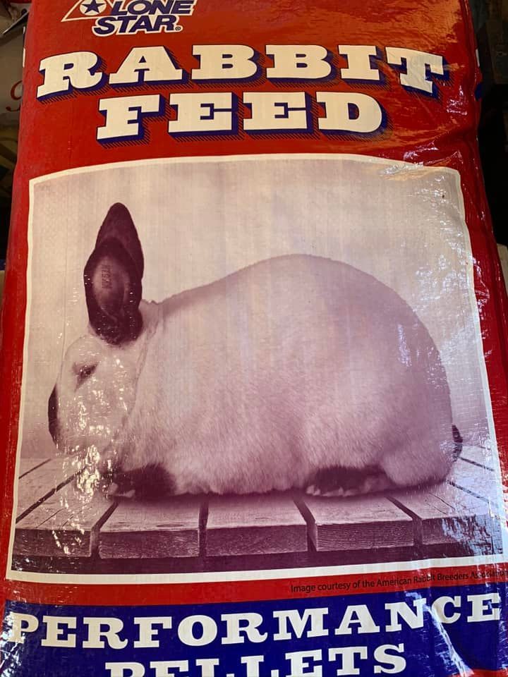 Rabbit Feed bag with a white rabbit on a red background, labeled “Performance Pellets.”