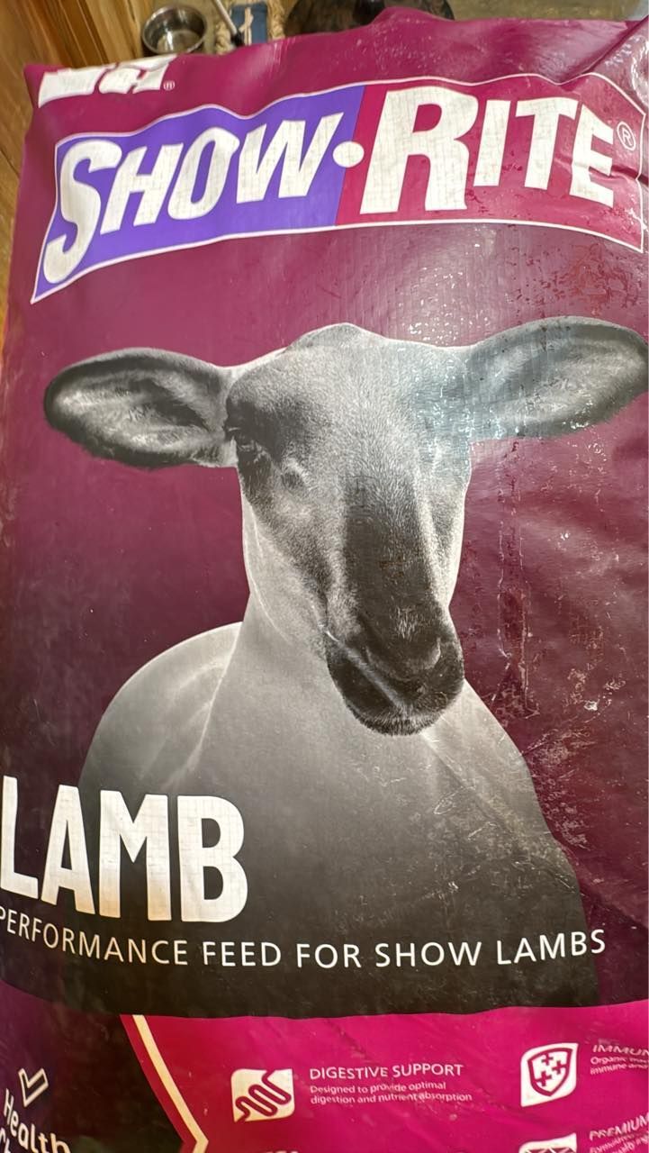 Snow-Rite lamb performance feed bag with a lamb head on a purple background