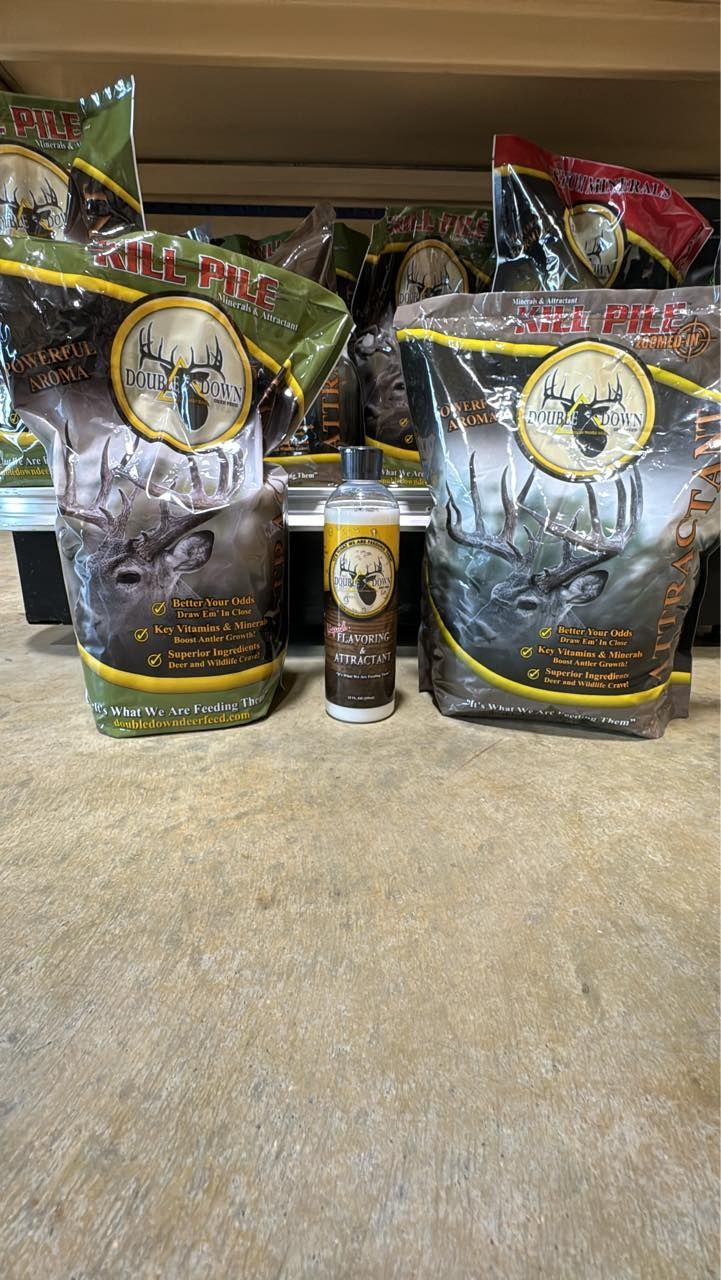 Pet food bags and a can arranged on a store shelf