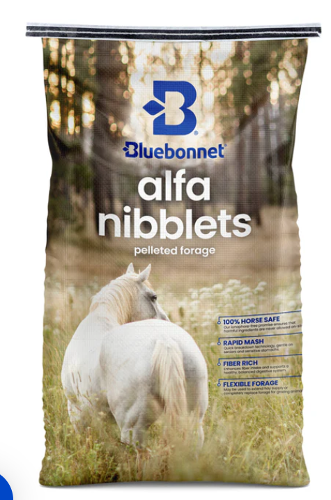 Bluebonnet Alfa Nibbets pelleted forage feed bag with a white horse in a field