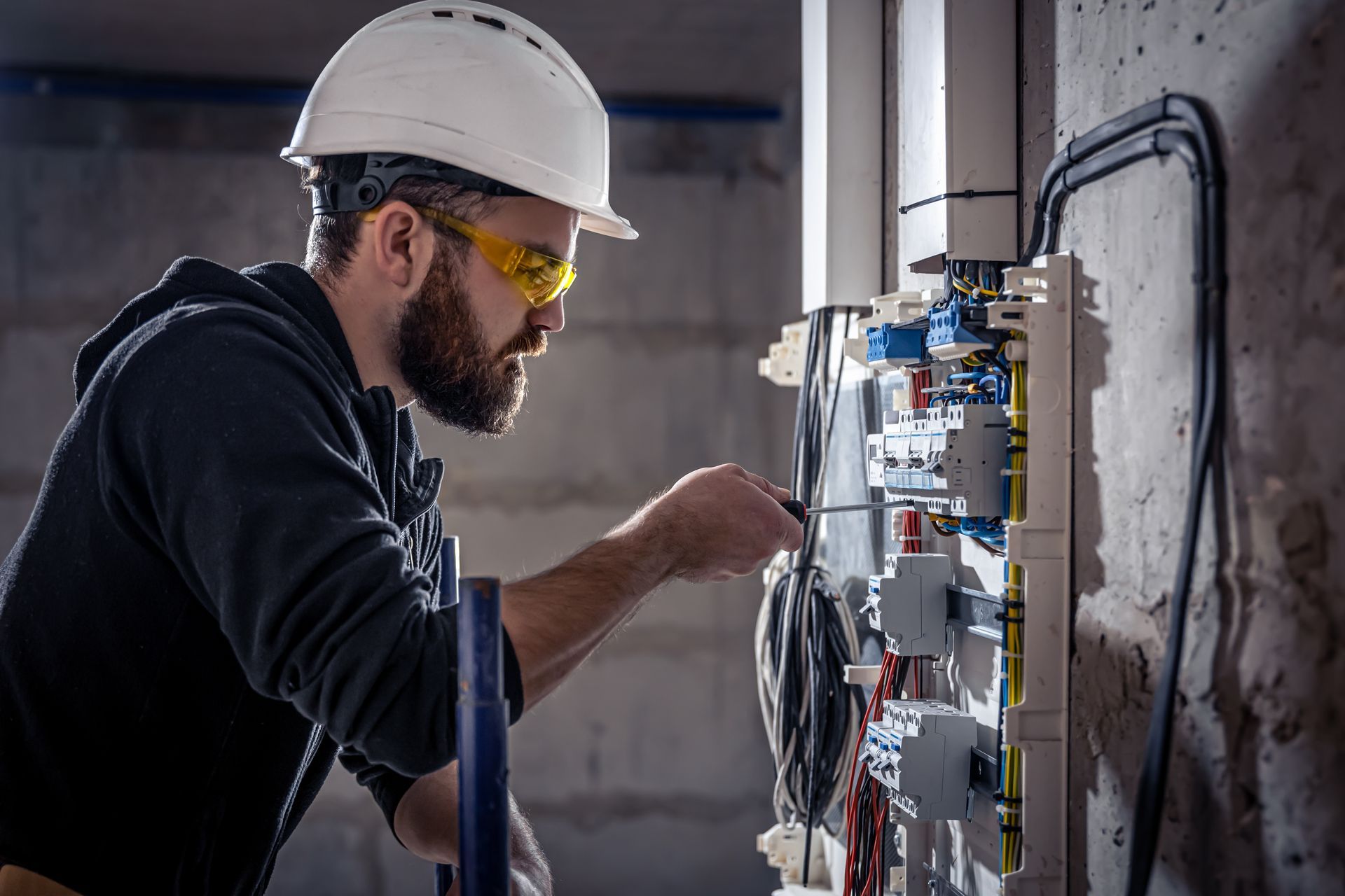Electrician working on electrical components